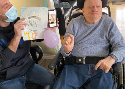 Jim is handed a birthday card by his staff member